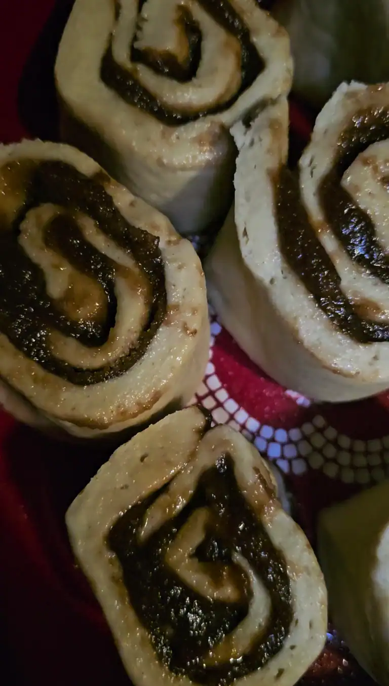 Unbaled apple butter cinnamon rolls in round baking dish