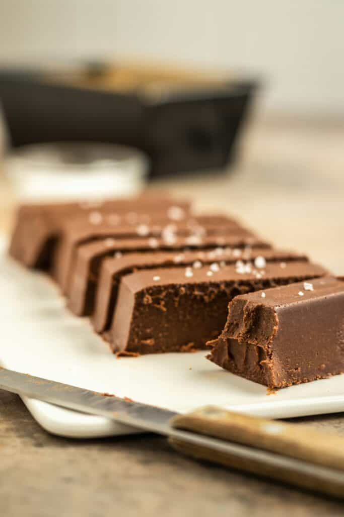Rich, decadent chocolate fudge with a smooth texture and sprinkled sea salt, perfect for sharing or gifting, showcasing handcrafted sweet treats from Night Owl Sugar Spell.