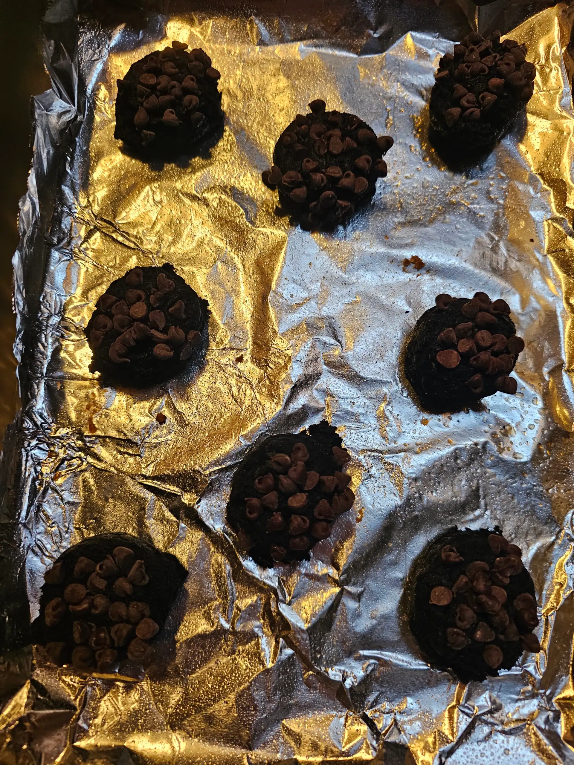 double chocolate black cocoa cookies on cookie sheet before being baked