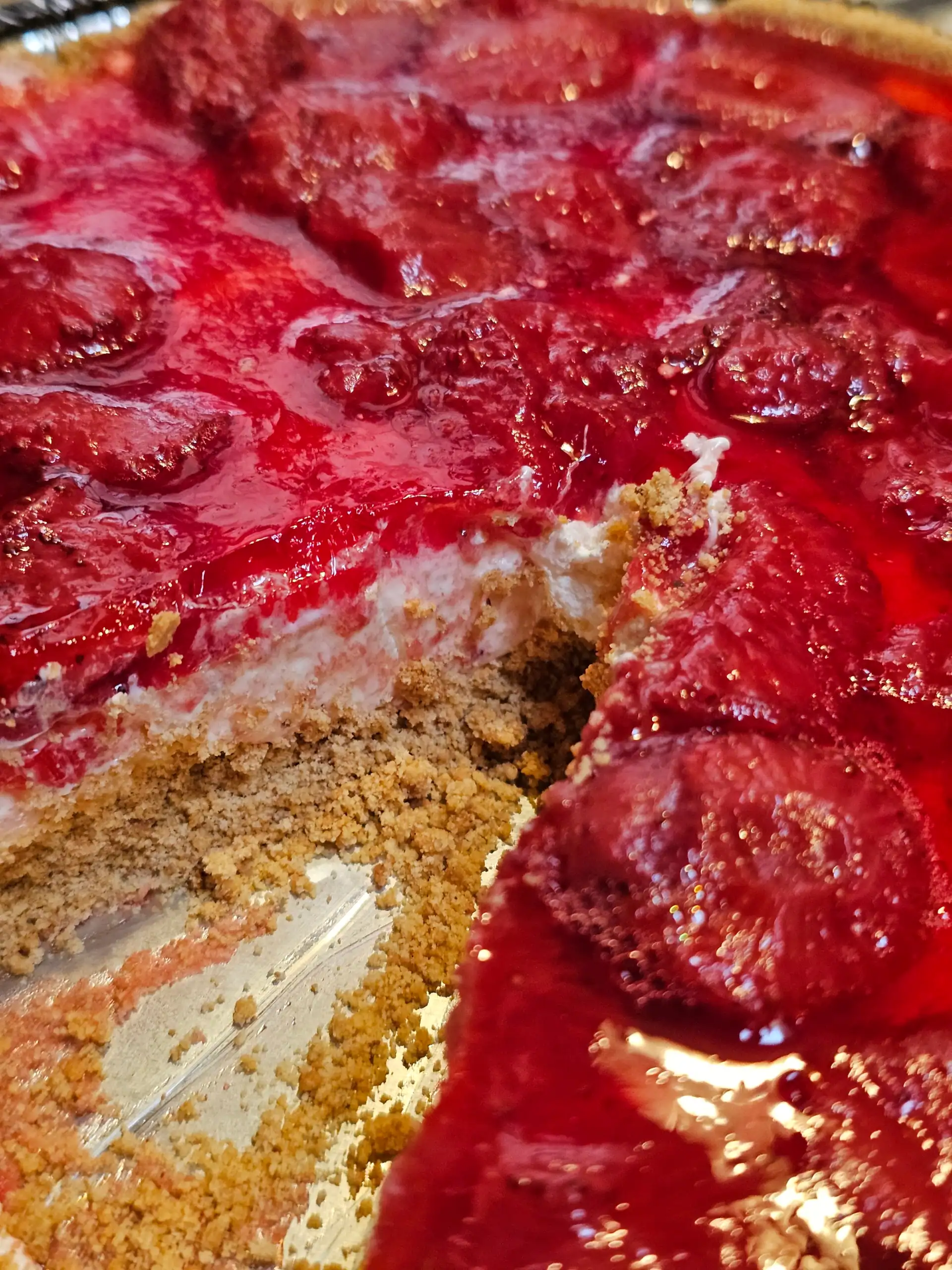 Strawberry pretzel salad with piece taken out